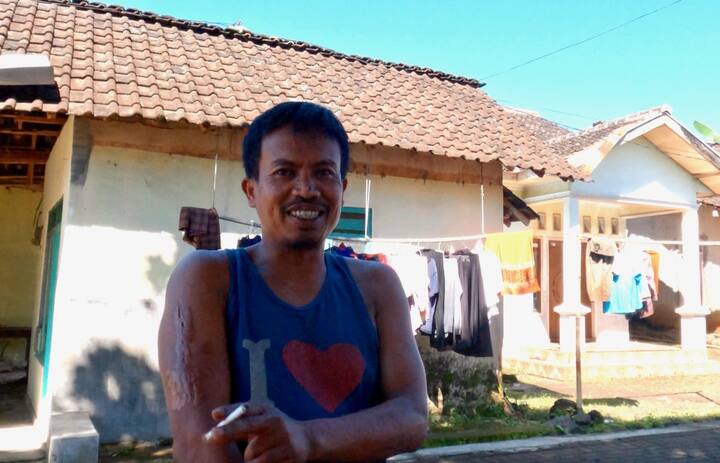 One of the miners, back in the village.